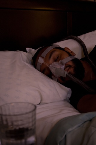 Man Sleeping with a CPAP Mask Image