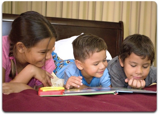 Group of Children Reading a Book Image